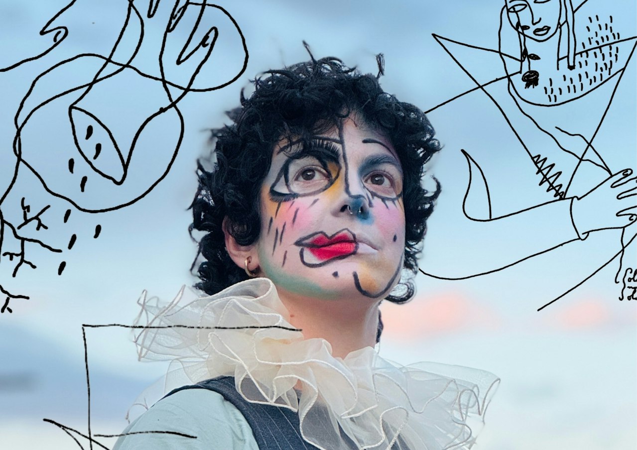 A photo of someone with short, brown curly hair, wearing a ruff, standing outside. They have clown-ish make-up on. Over the image there are illustrative scribbles in black pen.